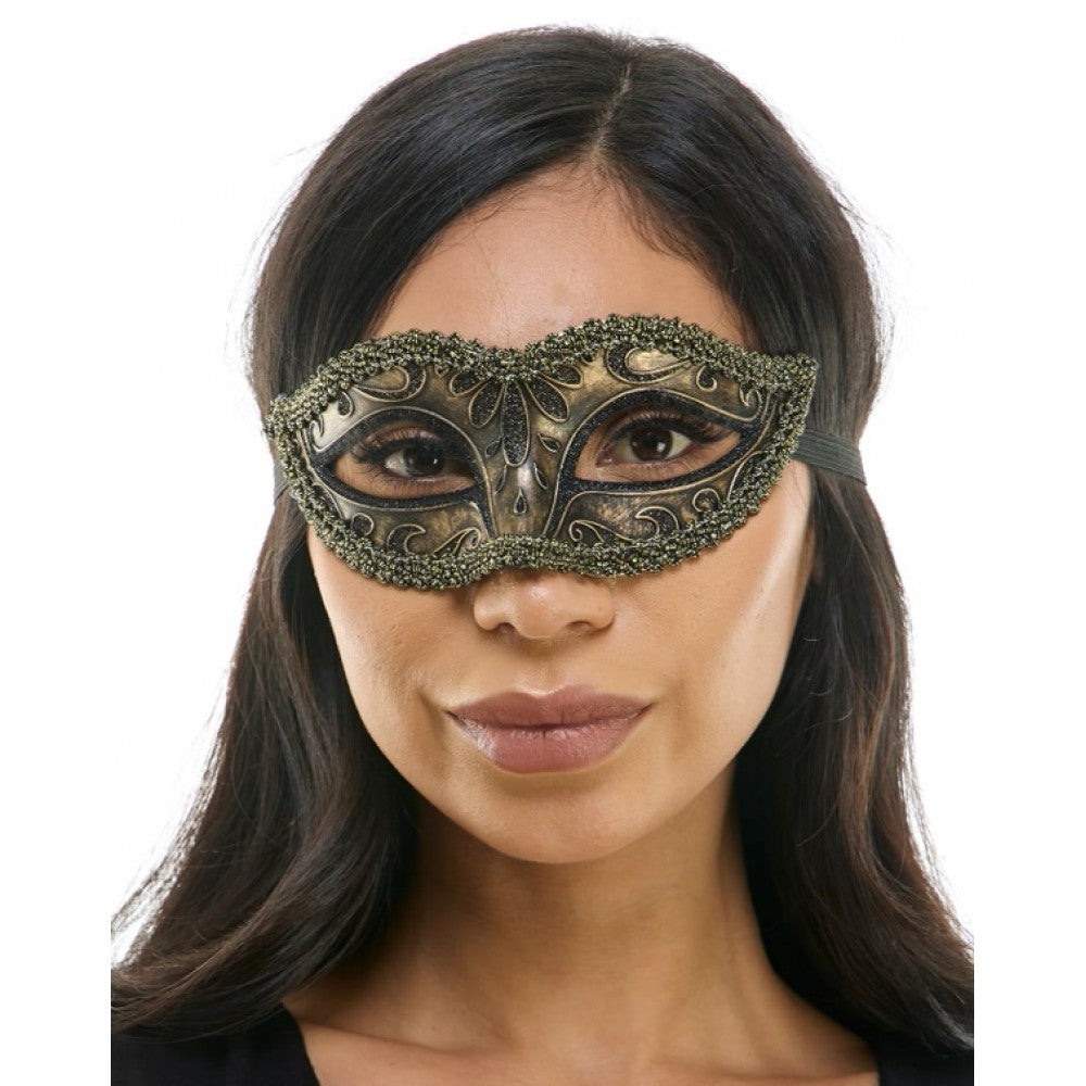Woman wearing a decorative mask on a white background
