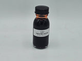Stage Blood 2oz glass bottle — deep red theatrical blood, close-up