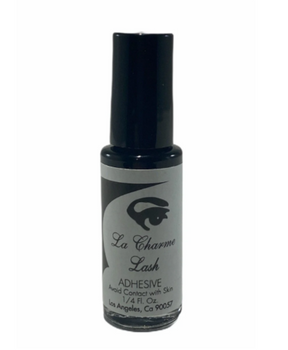 Bottle of La Charme Lash adhesive on a white background