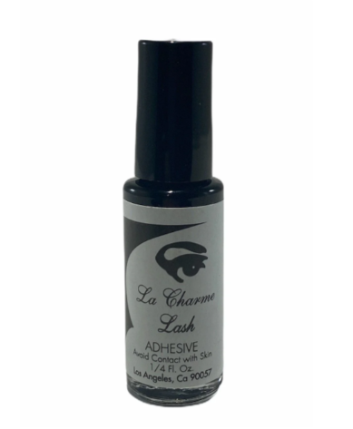 Bottle of La Charme Lash adhesive on a white background