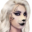 A close-up of a model with platinum blonde hair wearing animal print makeup, featuring black leopard spots on the forehead, cheek, and jawline, and a black nose on a pale base.